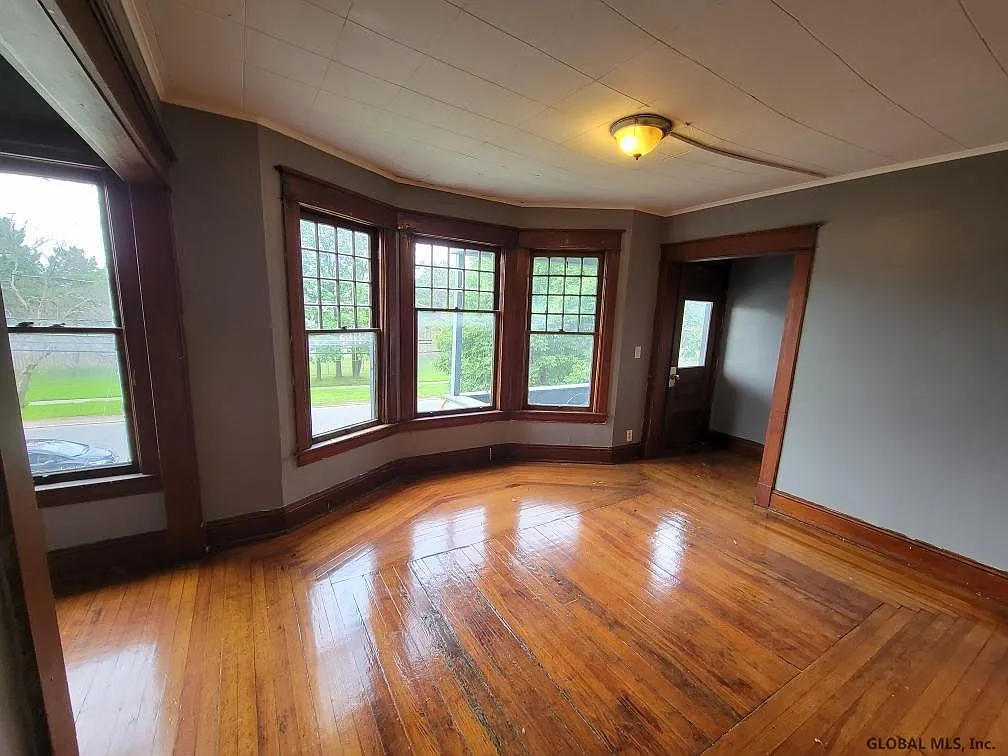 Living room with bay windows